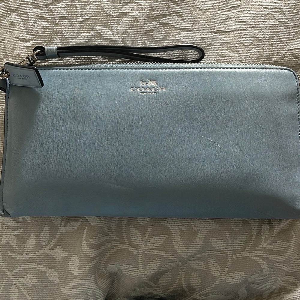 Blue coach large clutch. No stains